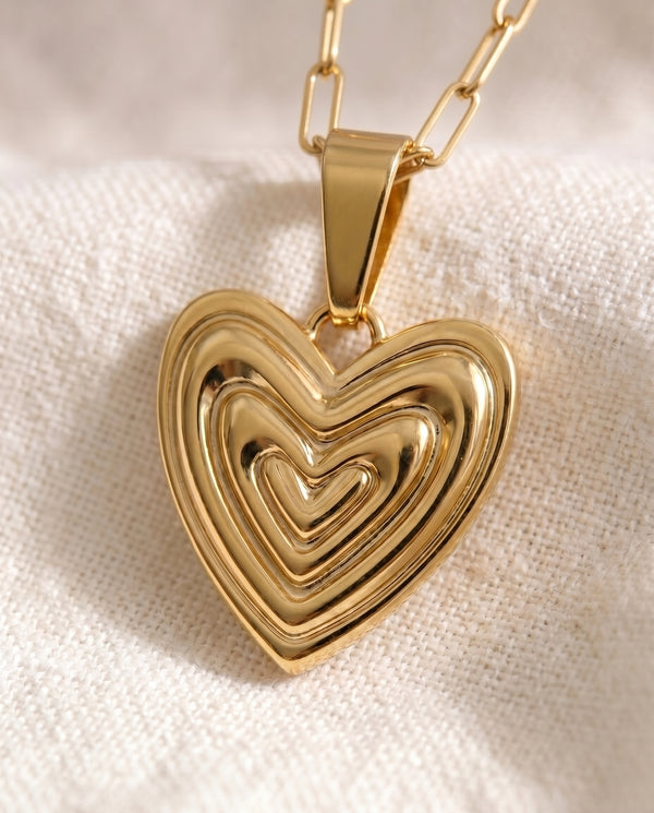 Heart on Your Sleeve pendant close up on paperclip chain
