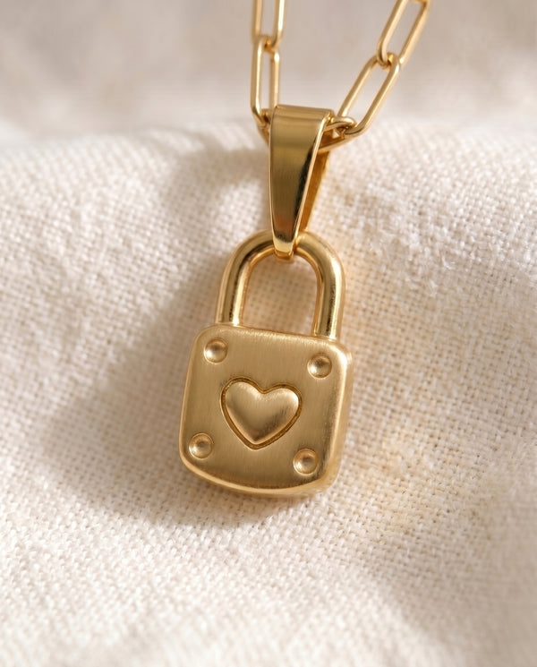 Little by Little Lock pendant close up on paperclip chain