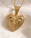 Heart on Your Sleeve pendant close-up on gold box-link chain