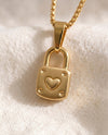 Little by Little Lock pendant close-up on gold box-link chain