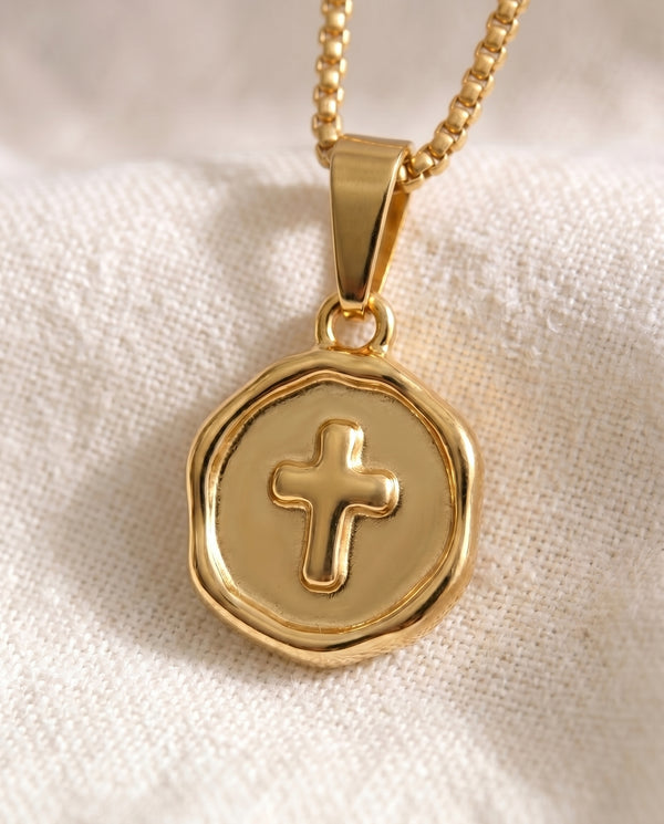 Blessed Beyond Belief Cross pendant close-up on gold box-link chain