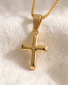 Deep Faith Cross pendant close-up on gold box-link chain