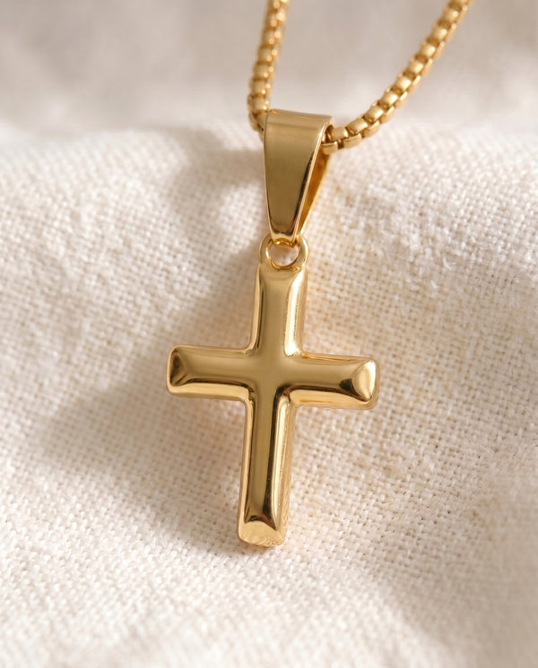 Deep Faith Cross pendant close-up on gold box-link chain