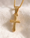 Quiet Devotion Cross pendant close-up on gold box-link chain