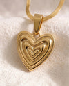 Heart on Your Sleeve pendant close-up on gold snake chain