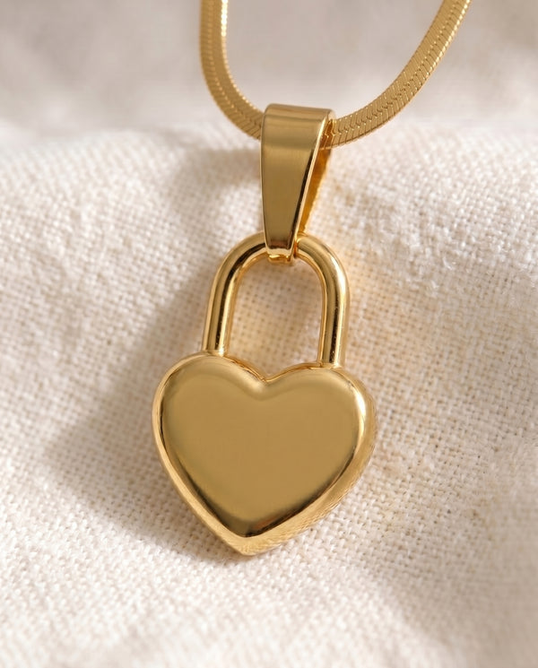 Love Language Lock pendant close-up on gold snake chain