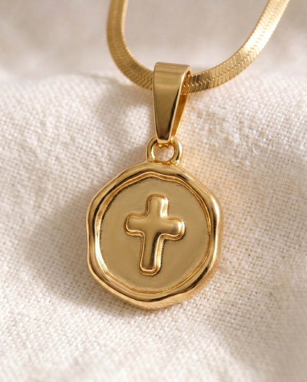 Blessed Beyond Belief Cross pendant close-up on gold snake chain