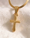 Quiet Devotion Cross pendant close-up on gold snake chain
